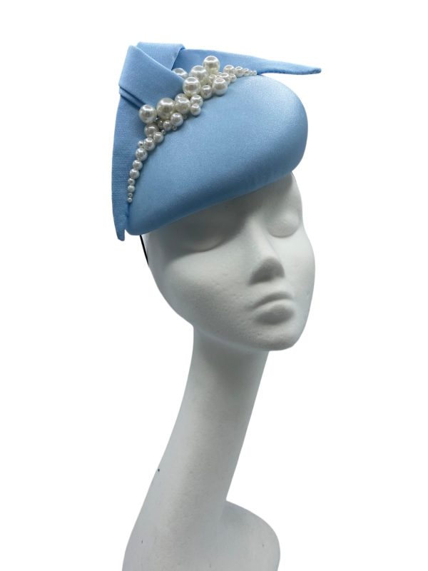 Baby blue teardrop shaped headpiece with pearl detail.